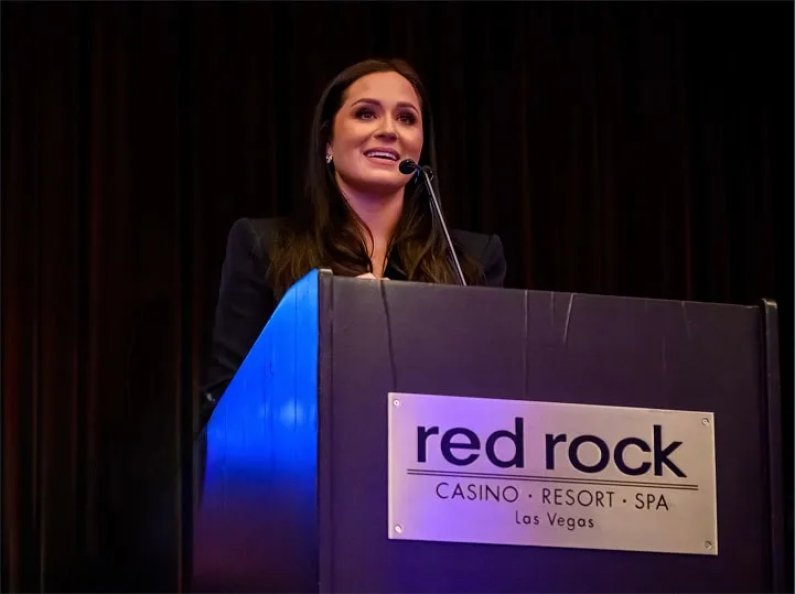 Blair speaking on stage